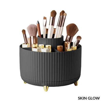 Black ribbed rotating makeup desktop storage box with gold feet and cosmetic brushes