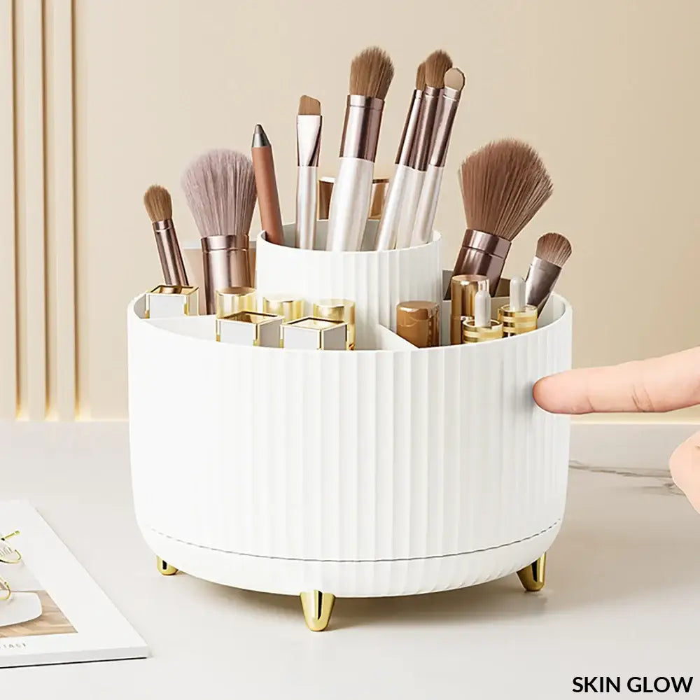 White ribbed rotating makeup desktop holder with gold-toned feet for stylish storage