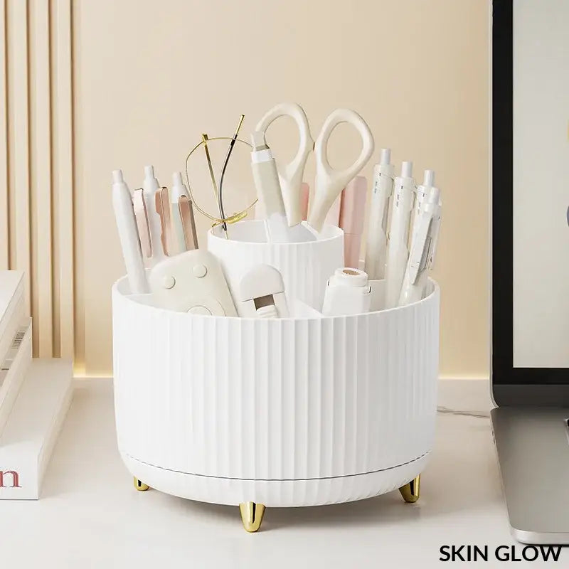 White ceramic rotating makeup desktop storage with gold feet holding beauty tools