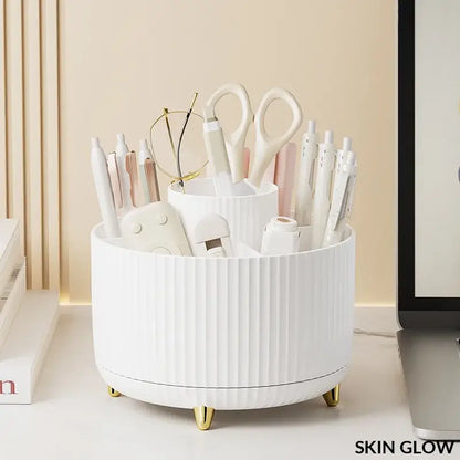 White ceramic rotating makeup desktop storage with gold feet holding beauty tools