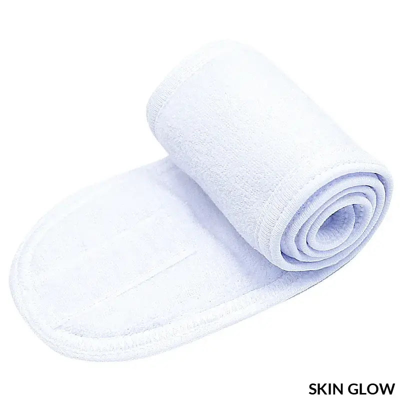 White rolled-up microfiber headband for skincare and beauty routines in washing bath spa