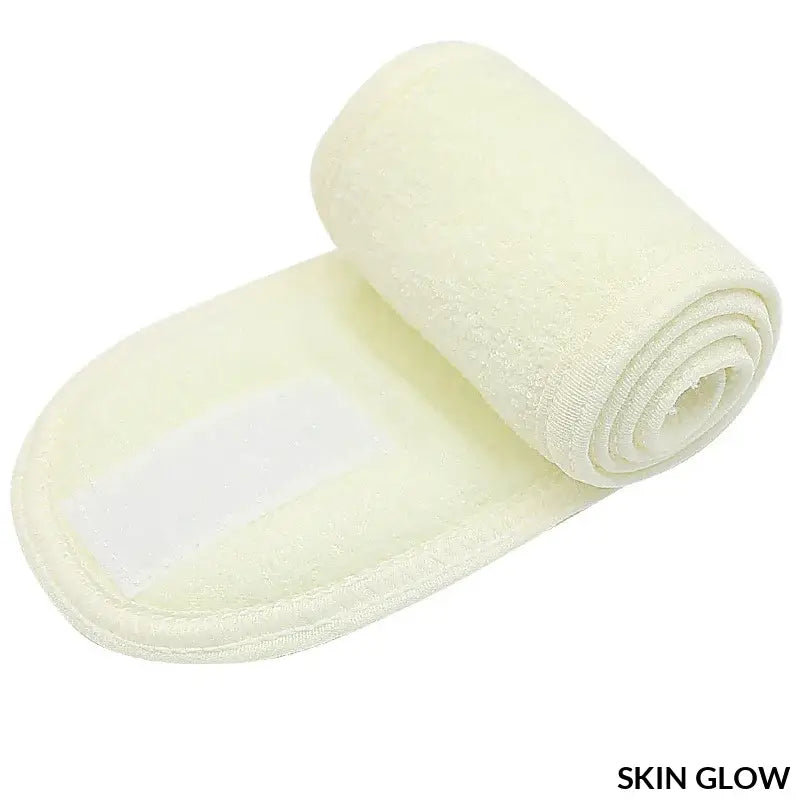 Rolled white exfoliating bath mitt, perfect for headband makeup accessories and face washing