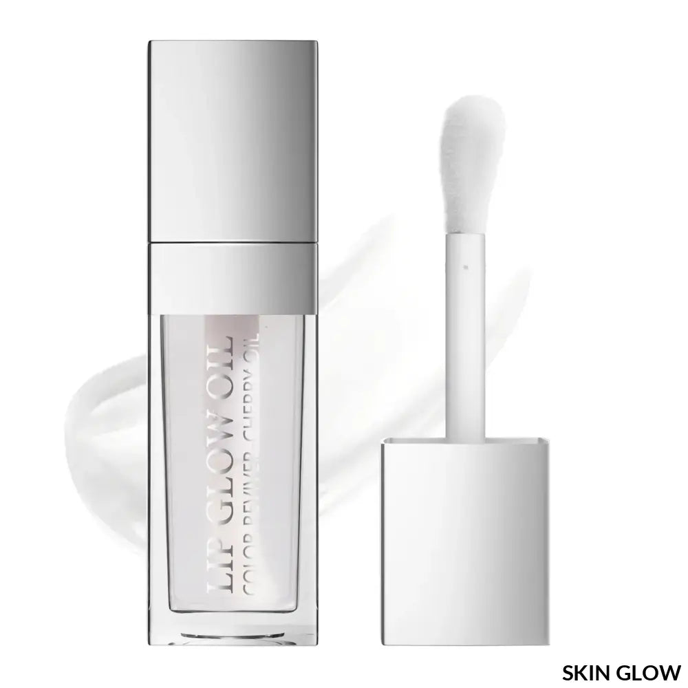 White lip oil gloss in a clear and silver container with an applicator wand