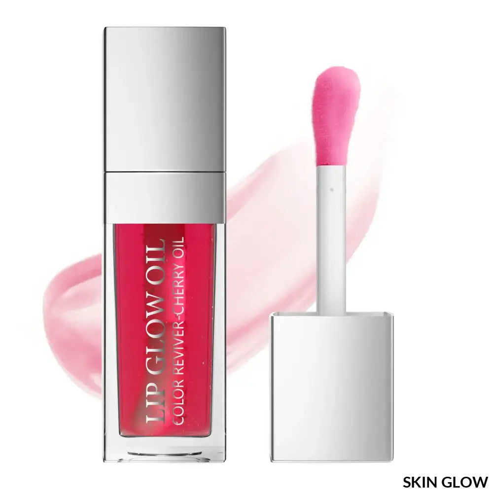 Pink lip oil gloss in a sleek silver container with an applicator wand